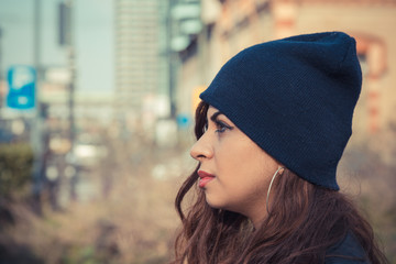 Beautiful girl posing in an urban context