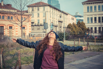 Beautiful girl posing in an urban context