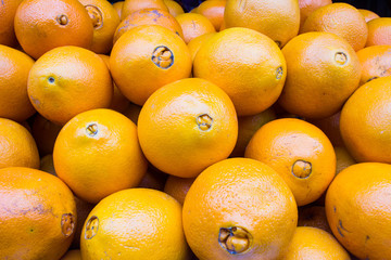 Bunch of fresh tangerines oranges on market