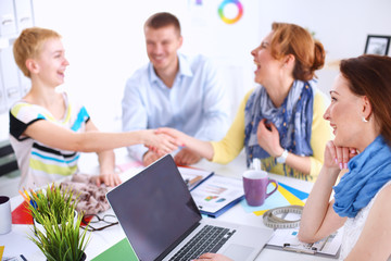 Fototapeta premium Business people shaking hands, finishing up a meeting