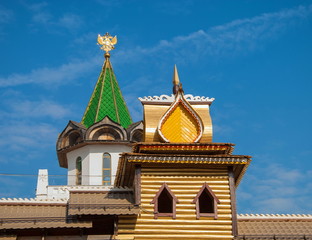 Log cabin and  beautiful tower with weather vane