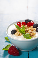 Healthy breakfast - yogurt with muesli and berries