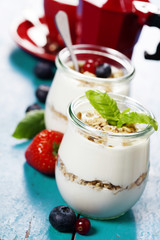 Healthy breakfast - yogurt with muesli and berries - health and