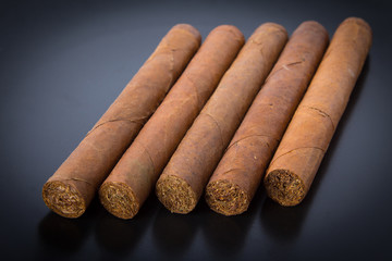 Cuban cigars on black background