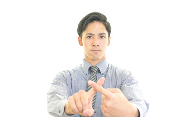 禁止の意思表示をするビジネスマン