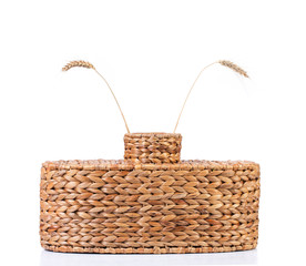 Wicker vase with wheat ears.