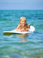 Little  boy has fun surfing