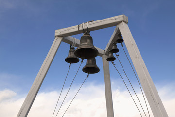 Fototapeta na wymiar Bells on belfry Orthodox church outdoors
