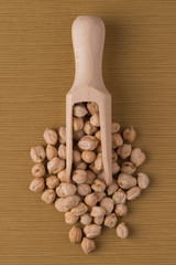 Wooden scoop with chickpeas