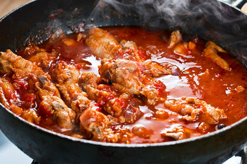 Stewed chicken in tomato sauce
