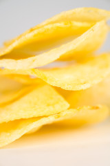 Naklejka na ściany i meble Potato chips on a white background