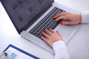 Fototapeta premium Young businesswoman working on a laptop