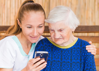 Elderly woman with caregiver