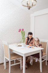 Mother and daughter with Easter eggs