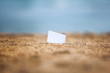 Visiting card on a beach
