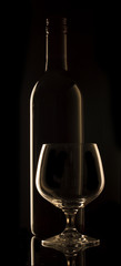 Wine Bottle with wine Glass Black background