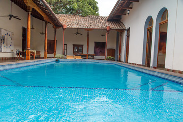 pool in garden in colonial house
