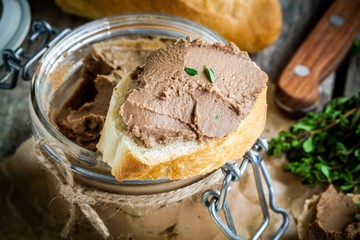 homemade chicken liver pate with fresh baguette closeup