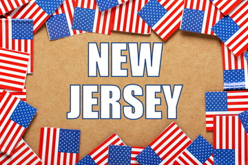 Fototapeta na wymiar The title New Jersey with a border of USA flags