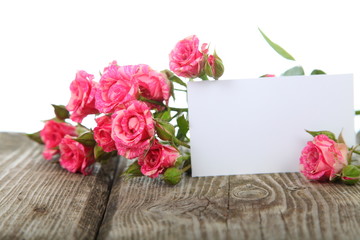 Bouquet of pink roses and greeting card