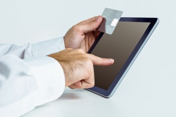 Man using tablet for online shopping