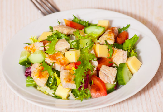 fresh vegetables salad with chicken and cheese