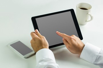 Businessman using his tablet pc