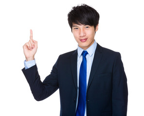 Asian businessman pointing up