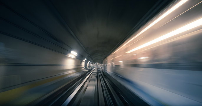 Subway tunnel and blurred light trails