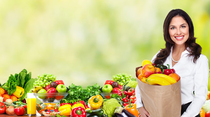 Woman with Vegetables over green background.