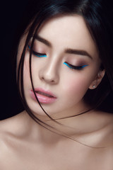 Close-up portrait of asian young girl with blue wings - 80256046