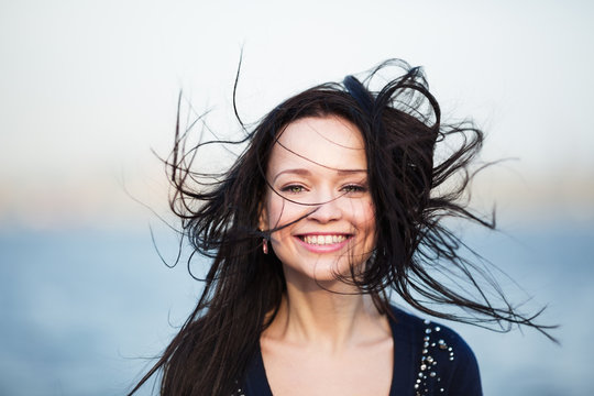 Smiling girl with long black hair