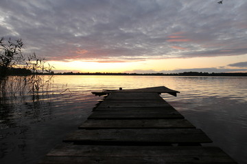 Fototapeta na wymiar old wooden pier at the lake