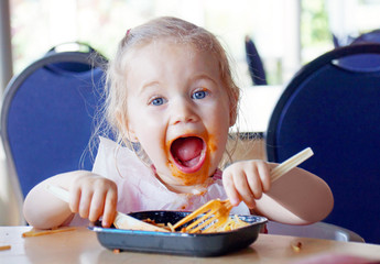 Kid having fun eating - 80258674