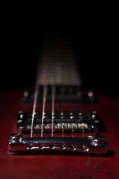 Element red electric guitar on a black background