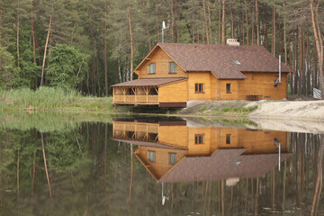 Naklejka premium Wooden house in the forest
