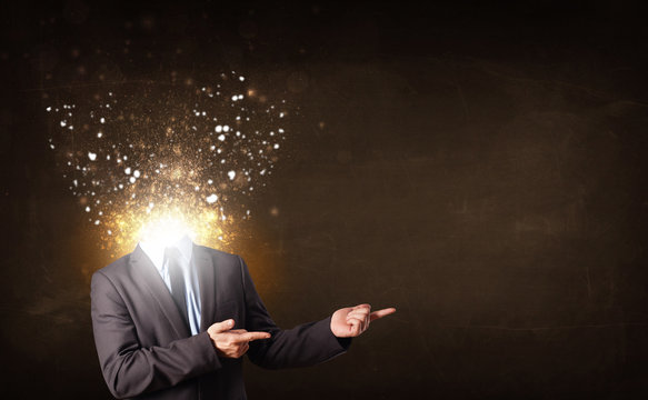 Business man with glowing exploding head