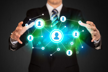 Businessman holding social media network
