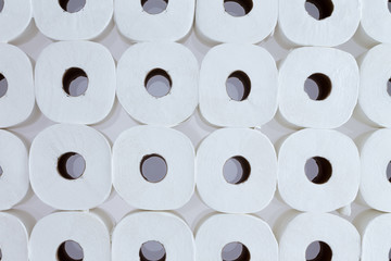 Background pattern of white toilet paper rolls