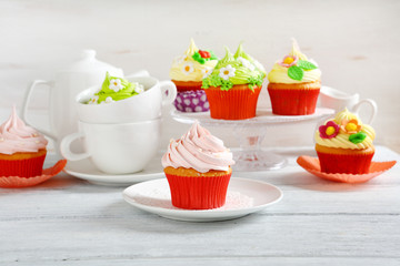 colorful cupcakes on rustic Easter table