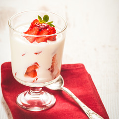 Fluffy and full of vitamins healthy strawberries on white wooden