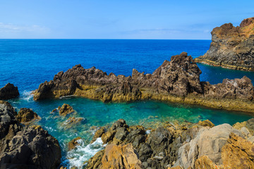 View of rocks on coast of Madeira island in Funchal, Portugal