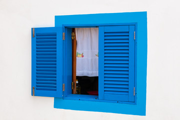 Blue window of a typical white house, Madeira island, Portugal