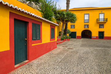 Yellow buildings of Sao Tiago castle in Funchal, Madeira island