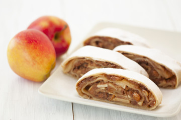 sliced into pieces apple strudel and fresh apples