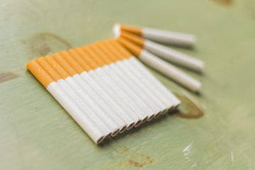 Cigarettes on Grunge Wood
