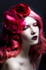 beautiful girl with pink hair, large rose flower in her hair