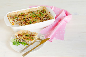 Homemade mushroom pie in white baking dish.