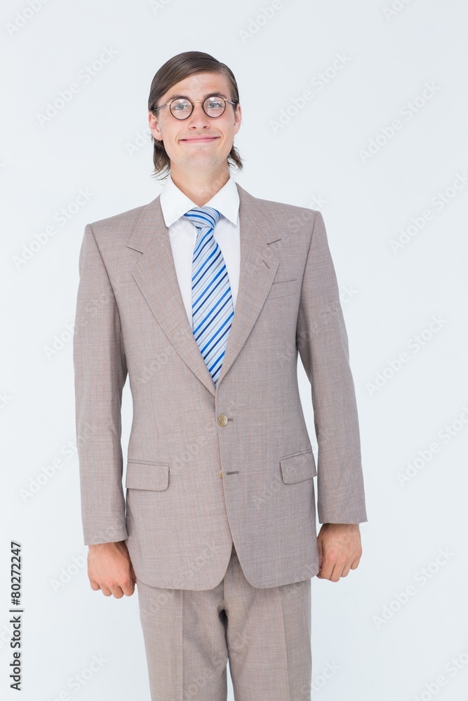 Poster geeky businessman looking at camera