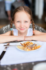 Little girl eating breakfast